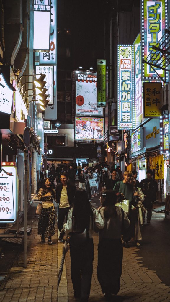 Explore the bustling street life of Tokyo, Japan, with vibrant city lights and diverse culture.